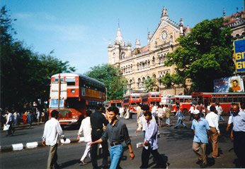 Red double-deckers outside Bombay Victoria Terminus...
