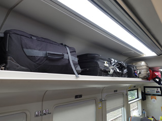 Overhead luggage racks on an indonesian train