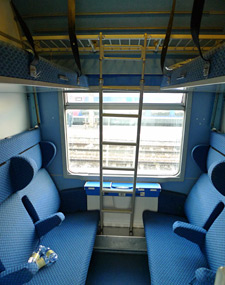 or 6-berth couchette compartment, with seats folded out, on the ...