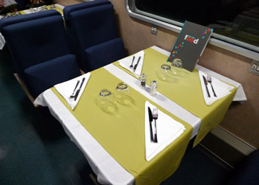 A table on the thello sleeper train to Venice, laid out for dinner
