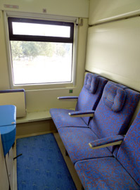 Standard sleeper in daytime mode with seats folded out