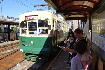 Boarding a tram at Nagasaki station