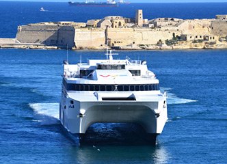 Virtu Ferries fast ferry from Sicily to Malta entering Valetta Harbour