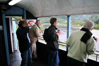 Taking photographs of the scenery from the Tranz Alpine's viewing car