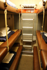 Couchette compartment on the Rail Europe Snow Train, in night mode with bunks folded out