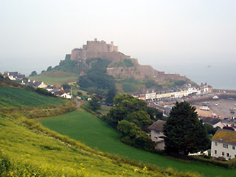 The Channel Islands:  Mont Orgeuil Castle, Jersey.  It's easy to reach Jersey by train & ferry.