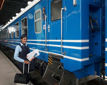 Attendant boards one of the new Cuban trains
