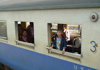 The E&O passes a Thai local train