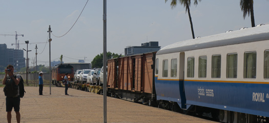 Cambodian passenger train with car transporters