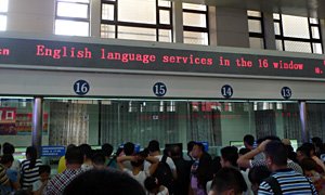 English language window at Beijing station ticket hall