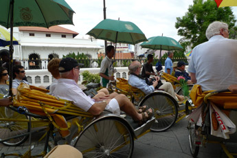 E&O passengers are treated to a trishaw ride in Georgetown, Penang.