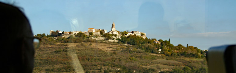 Hilltop village in the Rhone Valley seen from the Paris to Barcelona train