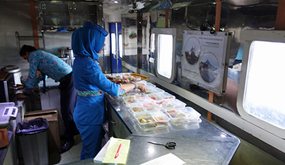Preparing the microwaved tray means on train 102, the Ranggajati