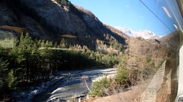 The train runs along a river