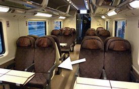 Luggage between the seat backs on an Italian train
