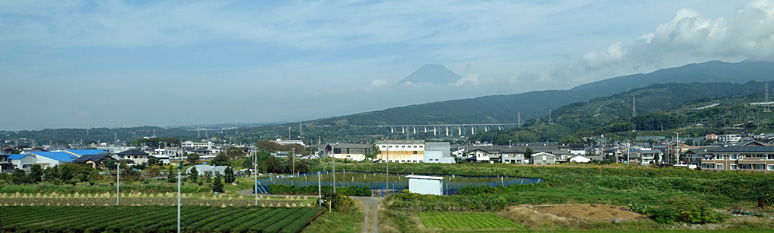 Mount Fuji in the mist seen from a shinkansen