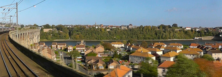 The train crosses the Royal Border Bridge at Berwick