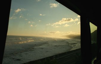 Soon after leaving Wellington, the Auckland-bound Overlander train passes along the coast...