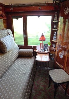 Orient Express LX-type sleeping-car compartment in day mode