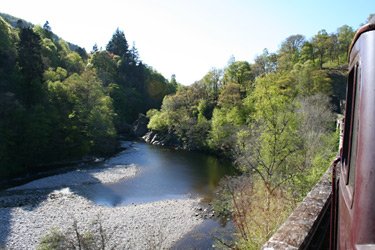 The Royal Scotsmn train passes another scenic stretch of river on the Highland Line