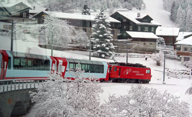 The Glacier Express passing a small Swiss village...