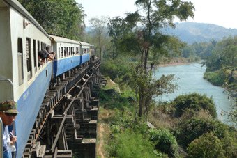 The 12:55 from Nam Tok to River Kwai Bridge, Kanchanburi & Bangkok passes over the Wampo Viaduct along the River Kwai...