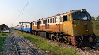 The afternoon train from Nam Tok & the Bridge on the River Kwai to Bangkok waits to leave Kanchanaburi.