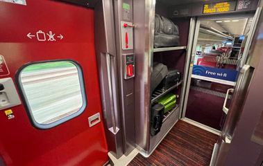 Luggage on Thalys goes on the racks just inside the door.