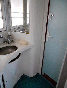 Private washroom with shower head in deluxe 2-berth sleeper on train 3 & 4.