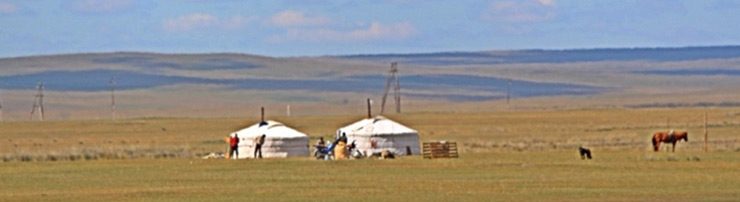 Yurts in the Gobi Desert, seen from the train