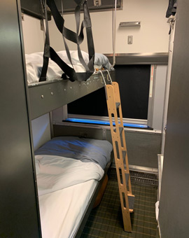 A bedroom in night mode in the Toronto-Vancouver train