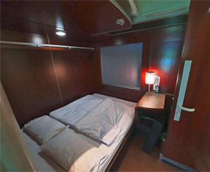 Double-bed in deluxe sleeper compartment