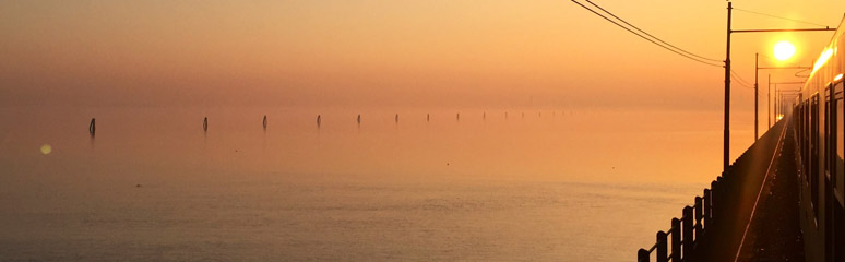 Sunrise as the sleeper train crosses the causeway into Venice