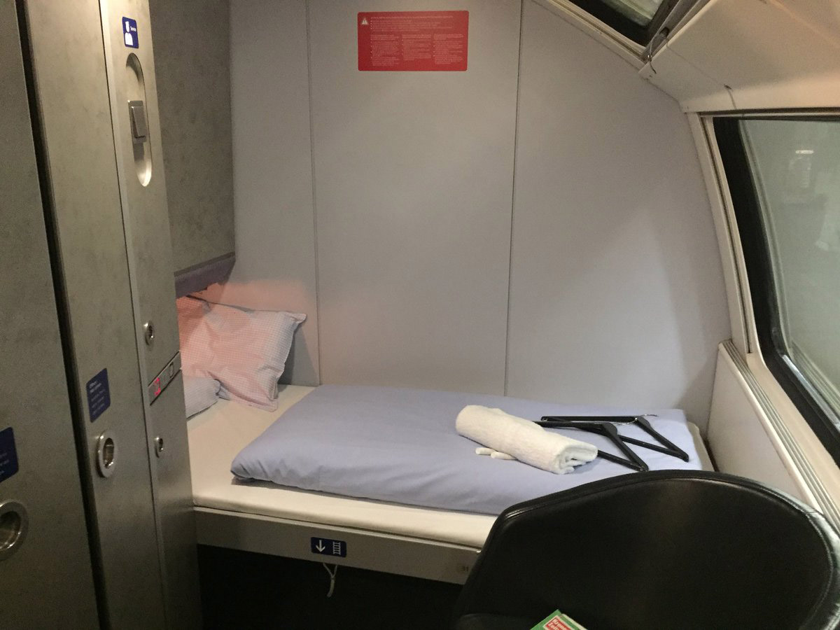 Deluxe sleeper on upper deck set up as a single-berth, looking the other wa...