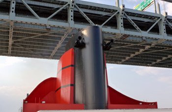 The QM2's funnel inches under the Verrazano Narrows bridge with just feet to spare