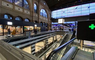 The escaltors down to shops & luggage lockers