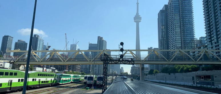 Looking back at the CN Tower as the train to Vancouver leaves Toronto