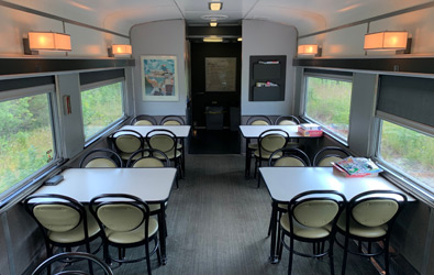 Tables area in a skyline car on the Canadian