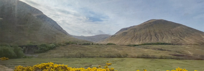 The sleeper to Fort William about to go around the horseshoe curve