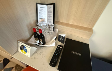 Complimentary wine, room service manu